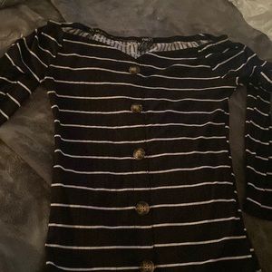 It’s a blank and white off shoulders crop top.